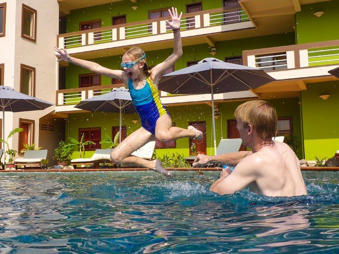 Tim and Kara playing in the hotel pool at the Two Moons Hotel in Kampot, Cambodia.