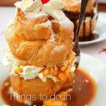 Windbeutel (German cream puff) on a white plate.