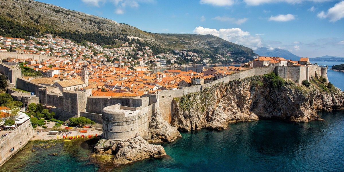 a city on a cliff above water