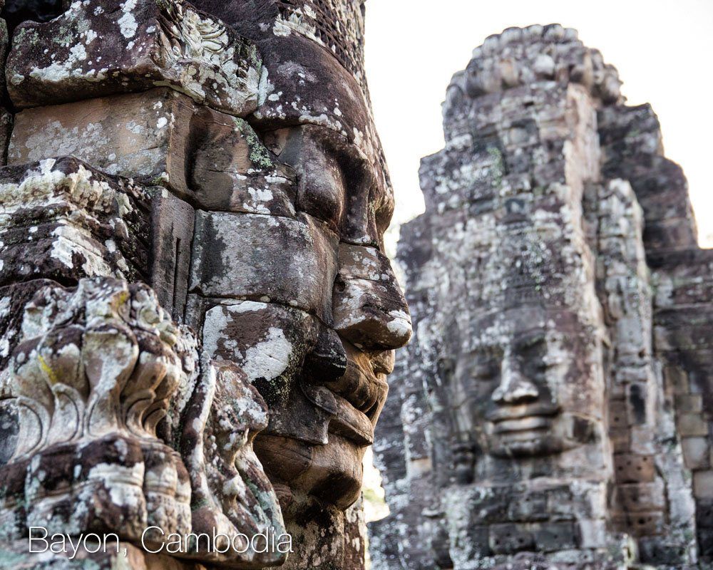 a stone statues with faces carved into them
