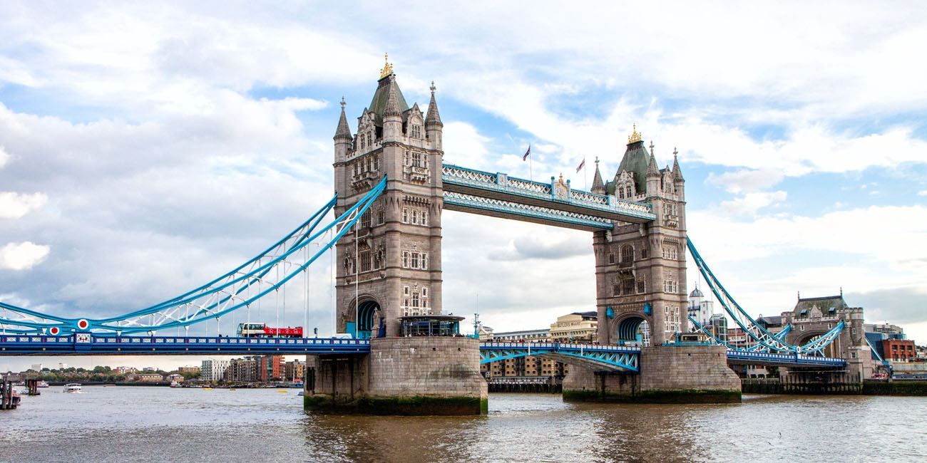 a bridge over water with a double decker bus