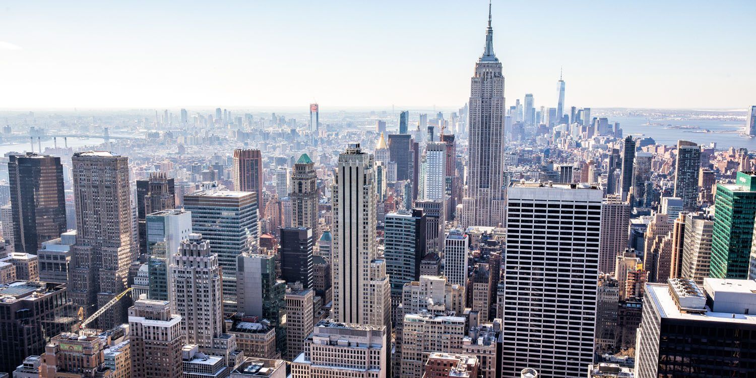 a city skyline with tall buildings