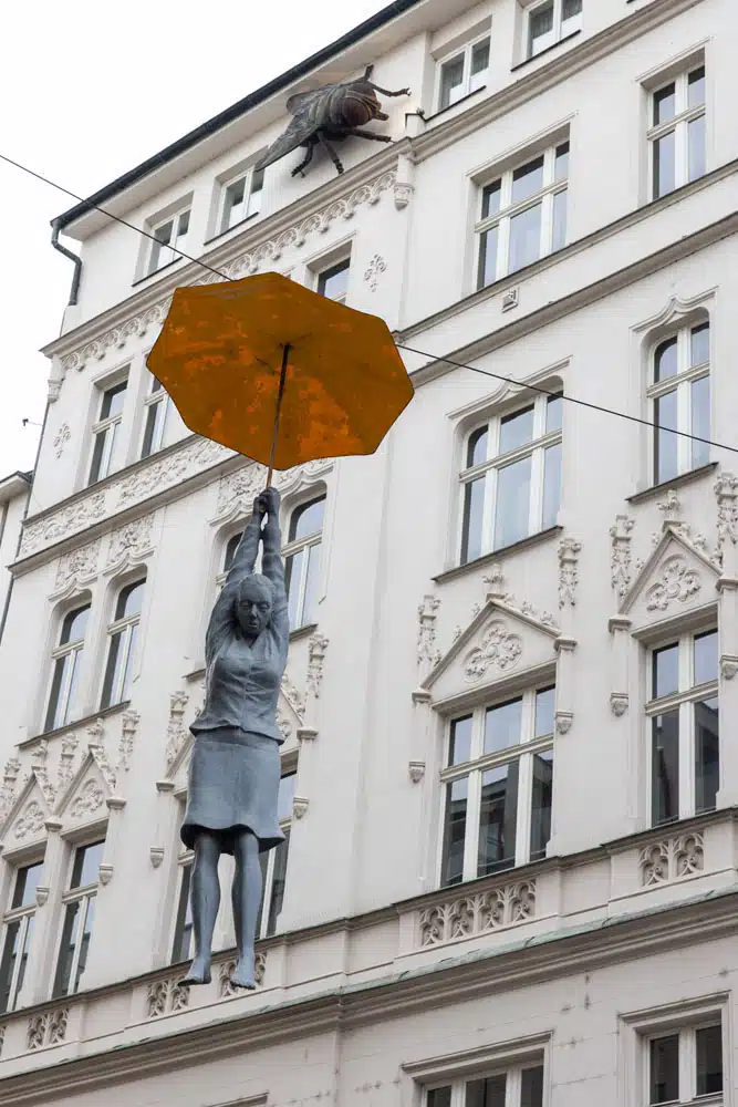 Woman with Umbrella | Best Things to Do in Prague