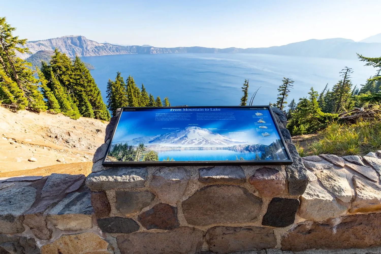 Sign and the view of the lake from the Rim Trail in Crater Lake