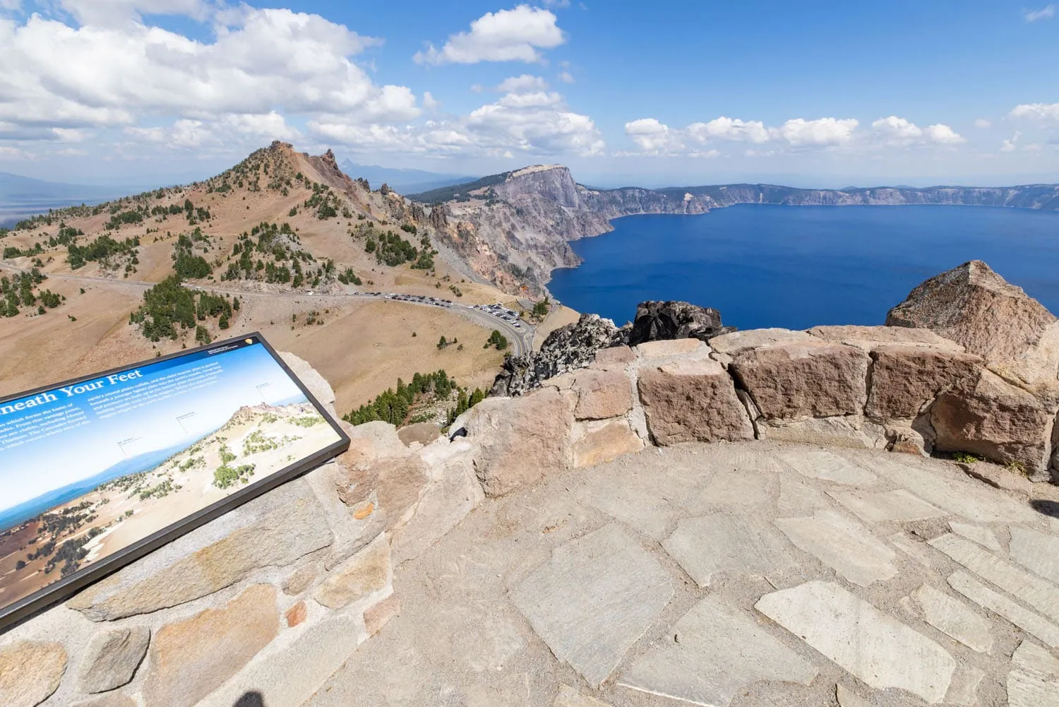 Watchman Peak Summit with stone walls and aerial view of Rim Drive