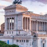 20 best views of Rome and its famous landmarks, including the Colosseum, St. Peter's Basilica, the Roman Forum, the Spanish Steps, rooftop bars and restaurants, the Tiber River, and more.